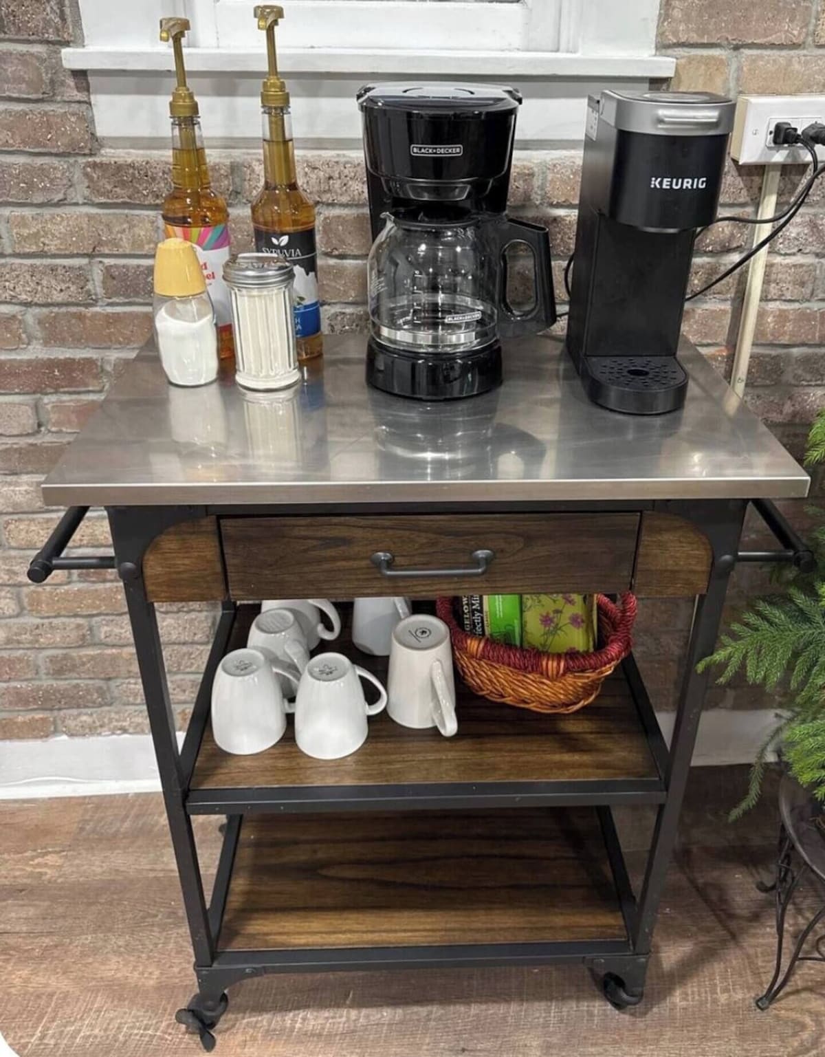 A kitchen counter with a coffee maker, a Keurig, and various kitchen items.